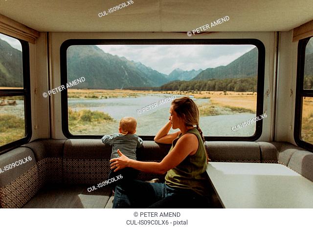 Mother and baby relaxing in motorhome, Queenstown, Canterbury, New Zealand