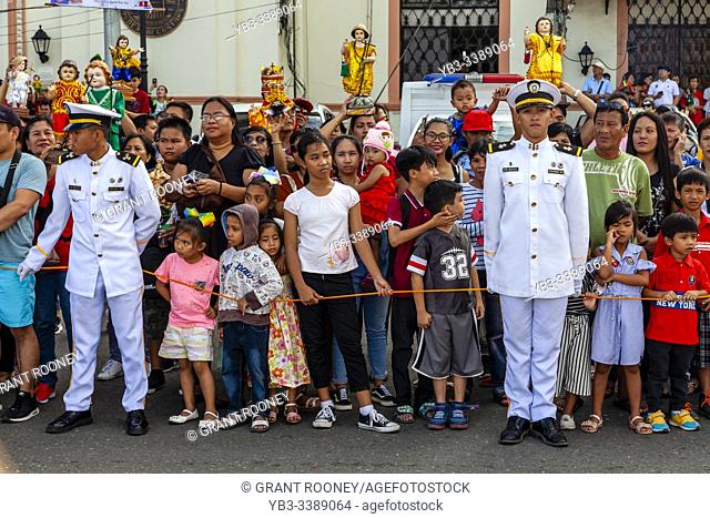 Local People Hold Up Their Santo Nino Statues As The Replica Santo Nino De Cebu Arrives By Sea, The Fluvial Procession, Dinagyang Festival, Iloilo, Panay Island