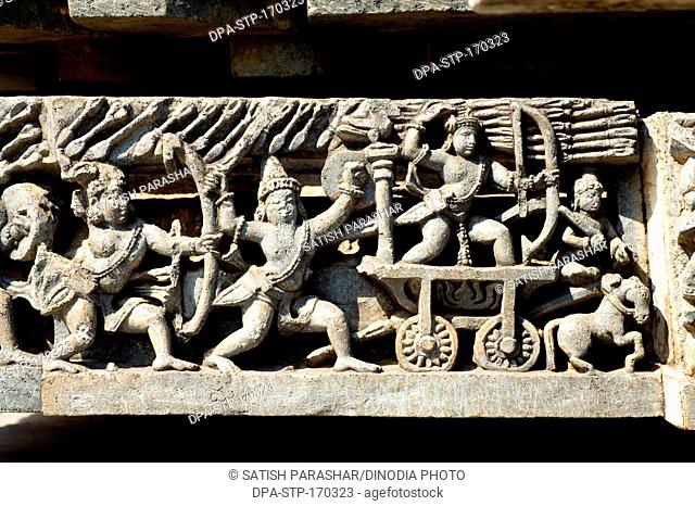 War scene carved on wall of hoysaleswara temple ; Halebid Halebidu ; Hassan ; Karnataka ; India