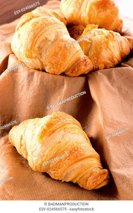 Selective focus on the front French croissant
