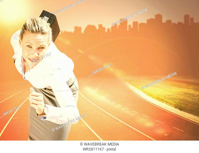 Business woman running with briefcase against orange flare and skyline