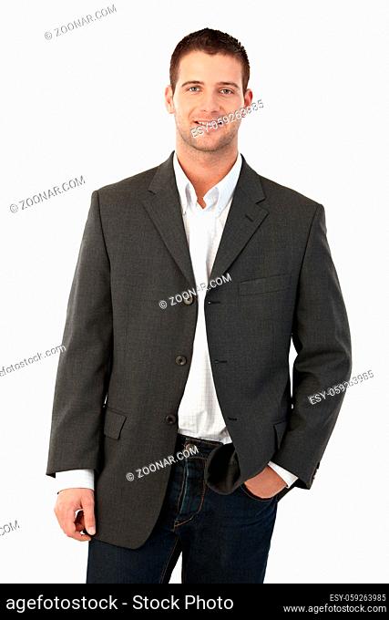Young man smiling, hand in pocket