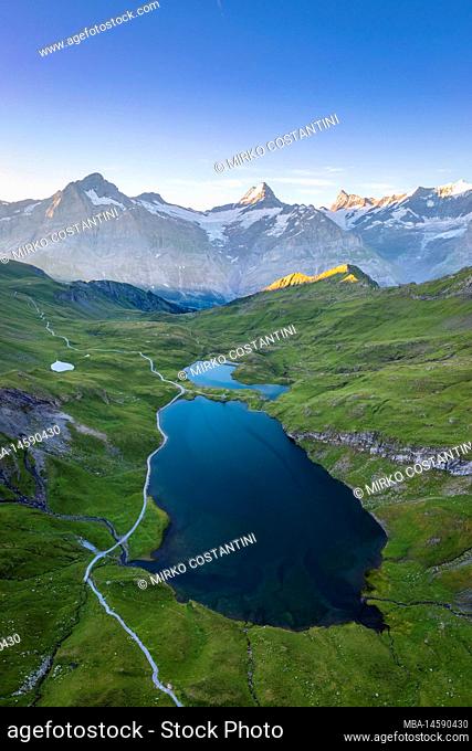 Aerial view of the Bachalpsee lake during a summer sunrise. Grindelwald, Canton of Bern, Switzerland, Europe
