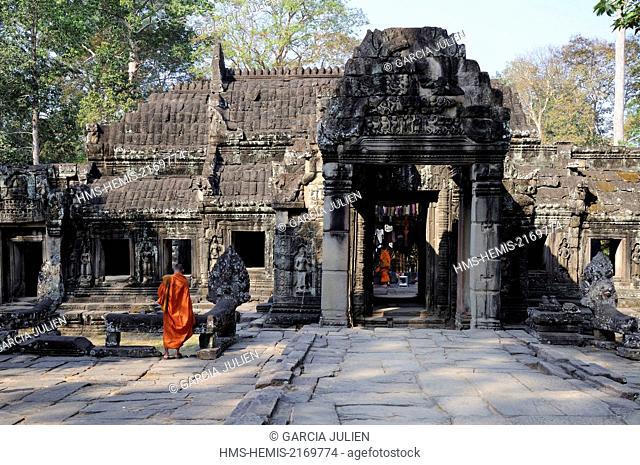 Cambodia, Siem Reap province, Angkor listed as World Heritage by UNESCO, buddhist monks in orange robes in Banteay Kdei temple
