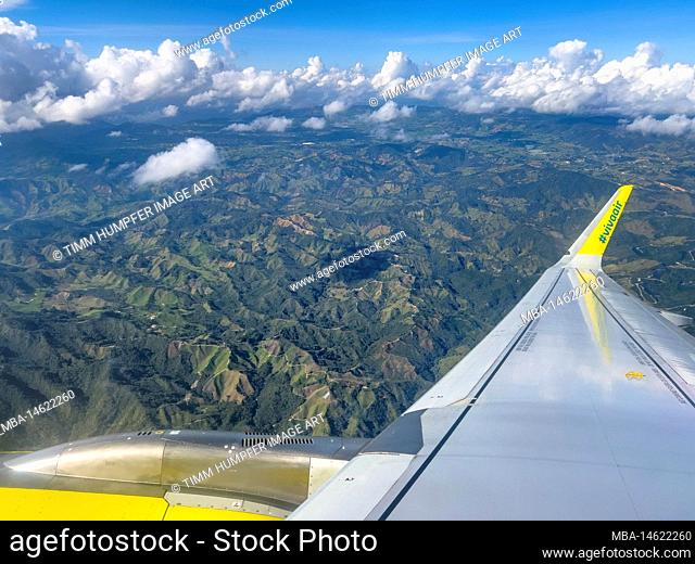 South America, Colombia, Departamento de Antioquia, Antioquia, view from the airplane window over the wing to the Colombian Andes
