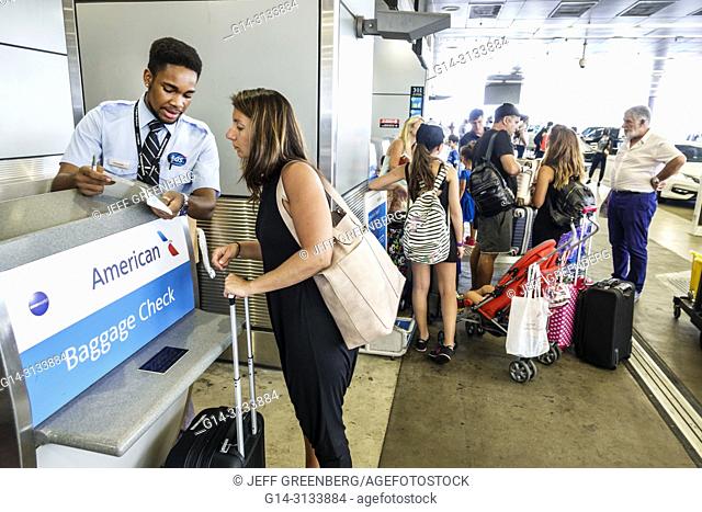Florida, Miami, International Airport MIA, terminal concourse gate area, American Airlines, curbside baggage luggage check-in, Black, man, woman, passenger