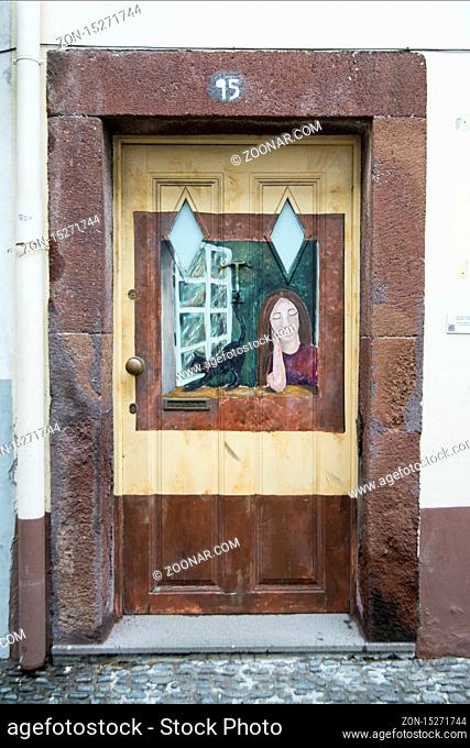 street and wall art at the old houses in the old town of zona Velha in the old city of Funchal at night on the Island Madeira of Portugal