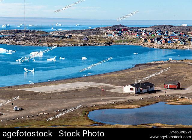 Qeqertarsuaq, Greenland - July 6, 2018: View of the heliport with the sea and the city in the background