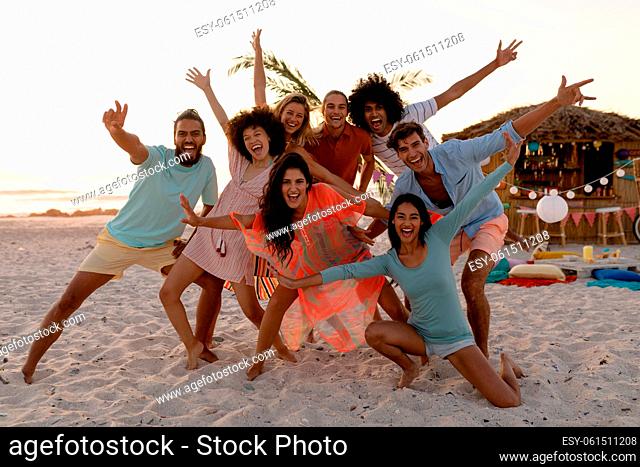 Multi-ethnic group of male and female having fun on the beach