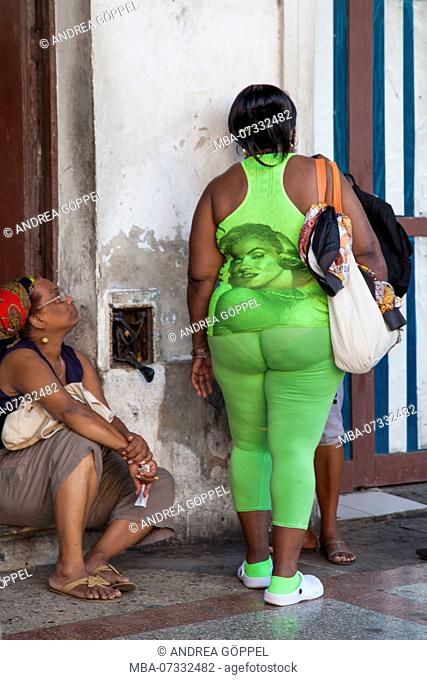 Caribbean, Cuba, Havana, woman in green clothing with 'Marilyn Monroe' print