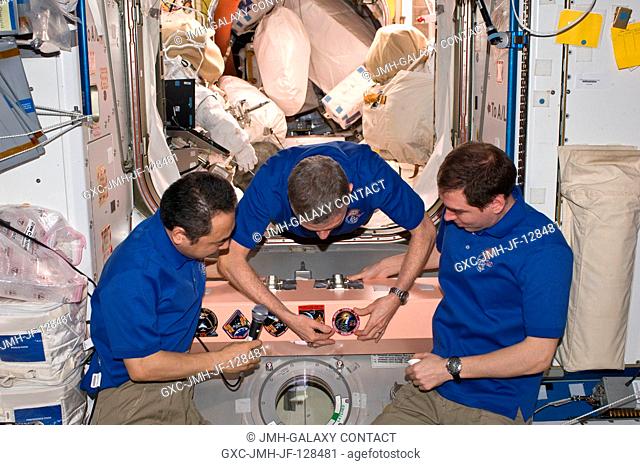 In the Unity node, Expedition 29 crew members add the Expedition 29 patch to the growing collection of insignias representing crews who have worked on the...