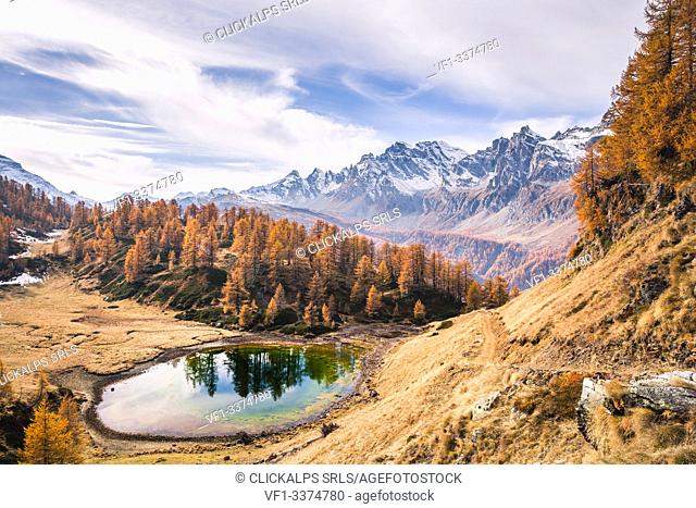 Reflection into Lago del Sangiatto in Alpe Devero in autumn, province of Verbano Cusio - Ossola, Piedmont, Italy