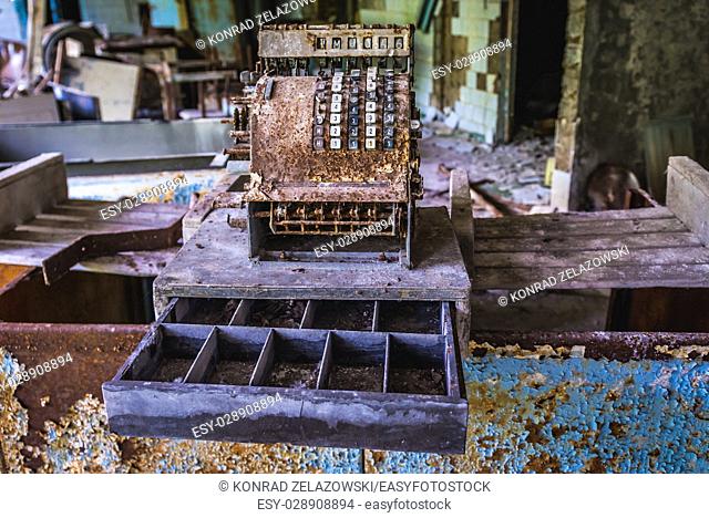 Old rusty cash register in High school No 2 in Pripyat ghost city of Chernobyl Nuclear Power Plant Zone of Alienation in Ukraine