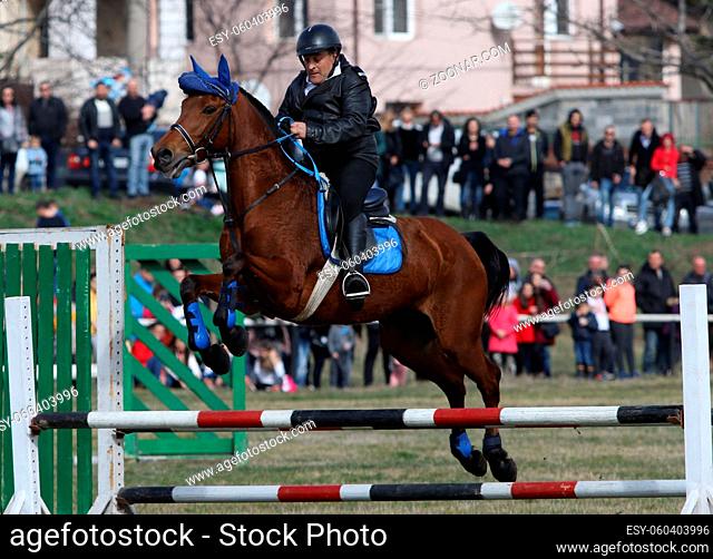 Sofia, Bulgaria - March 7, 2020: Bulgarian men ride their horses during celebrations marking the traditional holiday Todorov den also known as Horse Easter