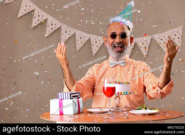 Senior man celebrating his birthday at home