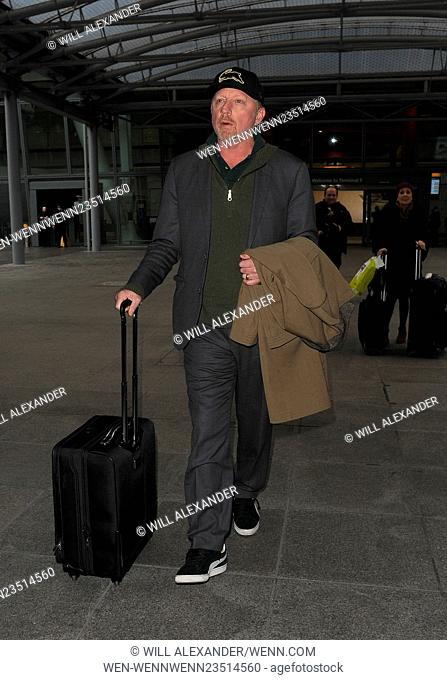 Boris Becker looks rather tired and puffy faced, as he limps through Heathrow Airport. It was unclear why he was limping