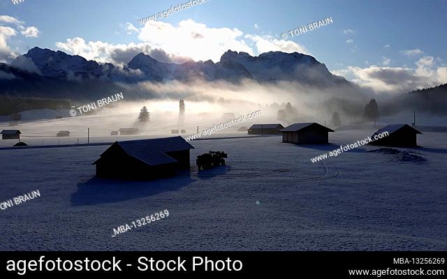 Germany, Bavaria, Isar Valley, winter landscape, in the lower Quicken in front of the Karwendel Mountains, wafts of fog