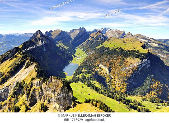 View from Mt. Hoher Kasten over the Stauberenfirst, down to Lake Saemtisersee, on the right Mt. Alp Sigel with the autumnal Sigelwald forest, Mt