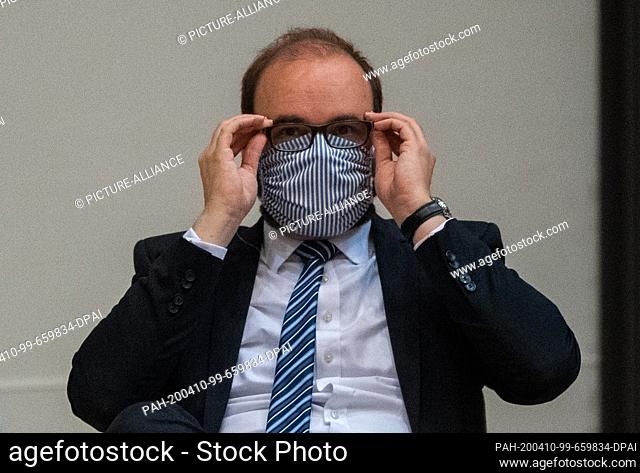 09 April 2020, Saxony, Dresden: Christian Piwarz (CDU), Minister of Education and Cultural Affairs of Saxony, is sitting in his seat during a special session of...