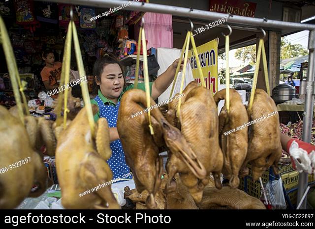 A cooked duck seller at the Samut Sakhon market, Bangkok, Thailand