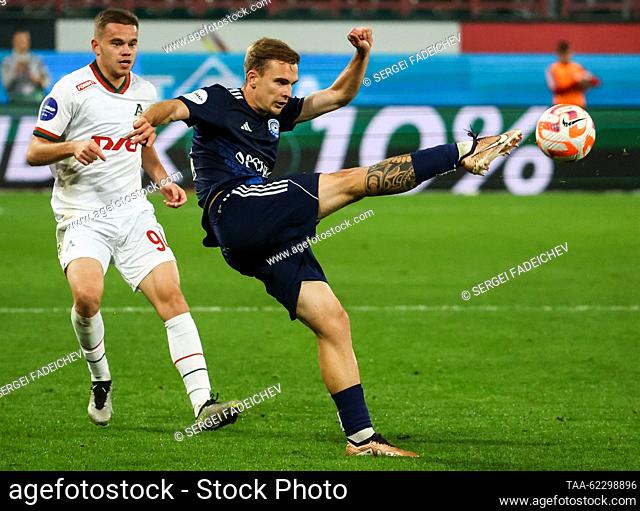 RUSSIA, MOSCOW - SEPTEMBER 18, 2023: Lokomotiv's Dmitry Rybchinsky (L) and Orenburg's Maxim Sidorov are in action in a 2023/24 Russian Premier League Round 8...