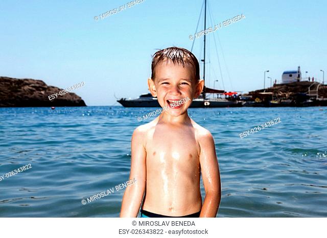 little smile boy in blue sea