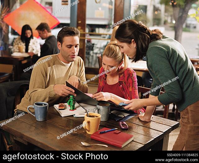 Couple ordering food at cafe