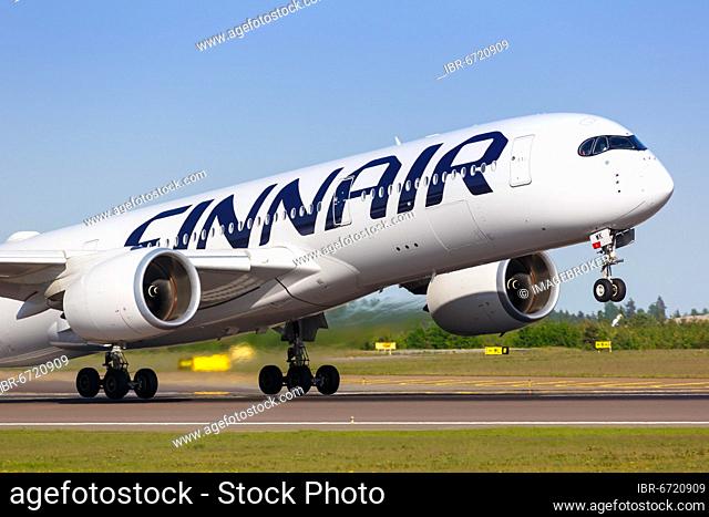 A Finnair Airbus A350-900 with the registration OH-LWK takes off from Helsinki Airport, Finland, Europe