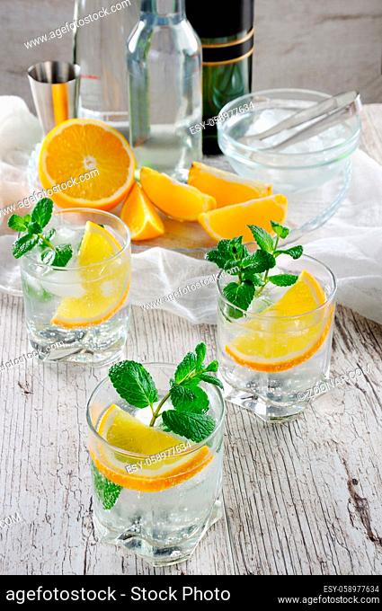 This is a light and refreshing summer cocktail with a white port, mixed with dry or sweet wine with a few drops of orange and a hint of mint