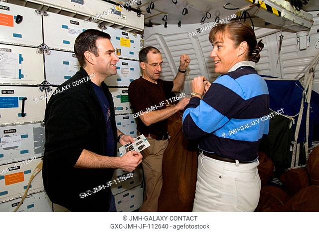 Astronauts Gregory E. Chamitoff (left), Expedition 17 flight engineer; Heidemarie M. Stefanyshyn-Piper and Donald R. Pettit, both STS-126 mission specialists