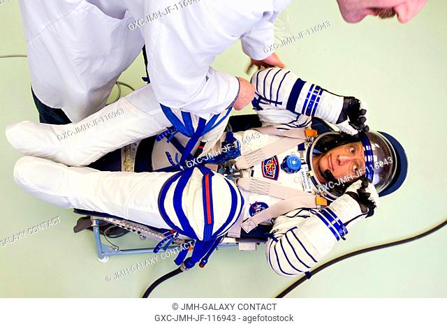 NASA astronaut Chris Ferguson, STS-135 commander, undergoes a fit check of his Sokol spacesuit on March 29, 2011, at the Zvezda facility in Moscow