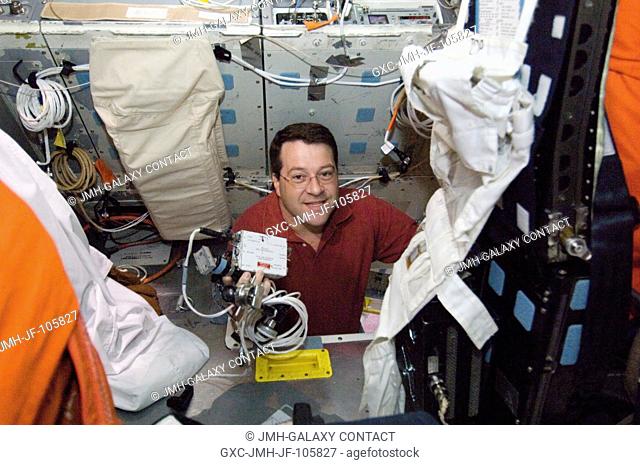 Astronaut Nicholas J. M. Patrick, STS-116 mission specialist, participates in a training session in the crew compartment trainer (CCT-2) in the Space Vehicle...