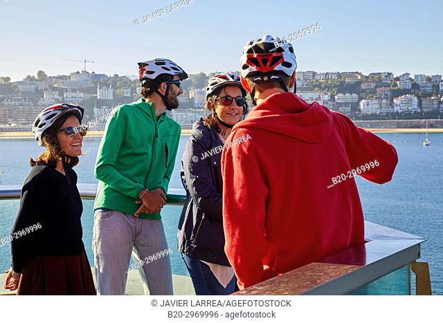 Group of tourists and guide making a bicycle tour through the city, La Concha Bay, Donostia, San Sebastian, Gipuzkoa, Basque Country, Spain, Europe