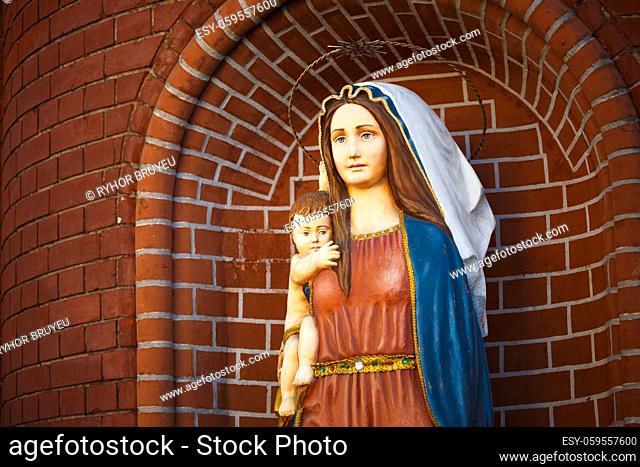 Statues of Holy Women in Roman Catholic Church. Blessed Virgin Mary with the young Jesus Christ in her arms