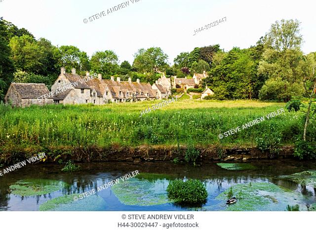 England, Cotswolds, Gloucestershire, Bibury, Arlington Row Cottages and River Coln