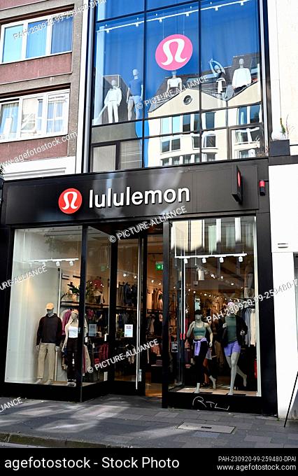 07 September 2023, North Rhine-Westphalia, Cologne: Logo lettering on a branch of the Canadian sports fashion label lululemon a yoga inspired functional...