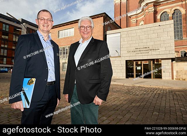 28 October 2022, Hamburg: Thoesten Schulze (l), managing director, and Alexander Röder, head pastor, stand in front of the new visitor center at Sankt Michaelis...
