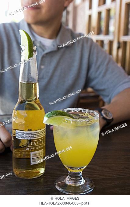 Margarita and beer on table at outdoor restaurant