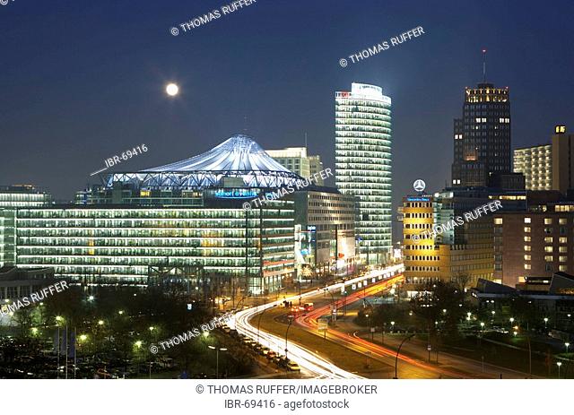 View of the lit buildings and multistoried buildings at the Potsdamer place in the evening, Berlin, Germany