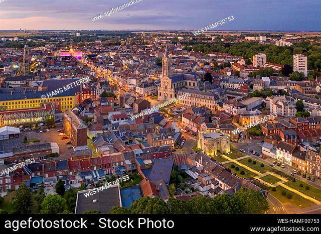 France, Nord, Cambrai, Aerial view of city at dusk