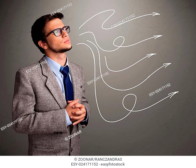 Attractive man looking at multiple curly arrows