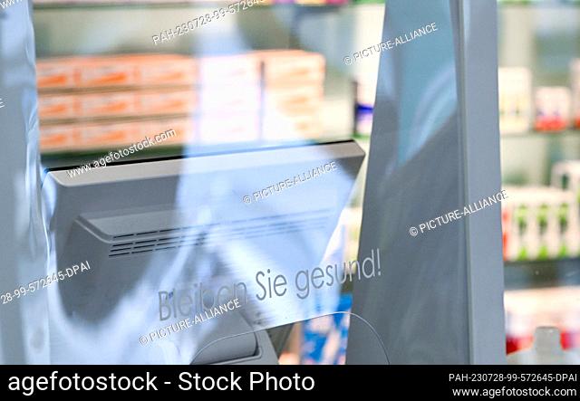 SYMBOL - 24 July 2023, Berlin: The words ""Stay healthy!"" are written on a window in a pharmacy. Photo: Jens Kalaene/dpa. - Berlin/Berlin/Germany