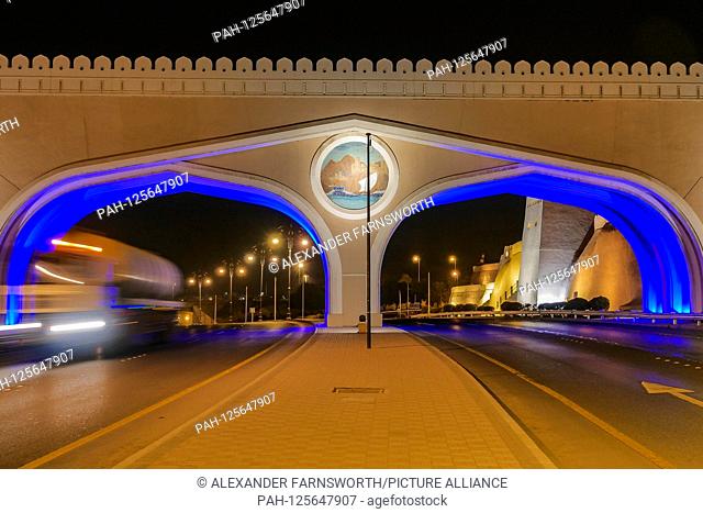 Muscat, Oman Illuminated entrance gateway by road to the Muttrah and Sultan Qaboos port. Urban beautification | usage worldwide. - Muscat/Oman