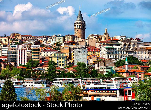 Istanbul city skyline with Galata Tower, tour boats and ferries on Golden Horn, Beyoglu district, Turkey