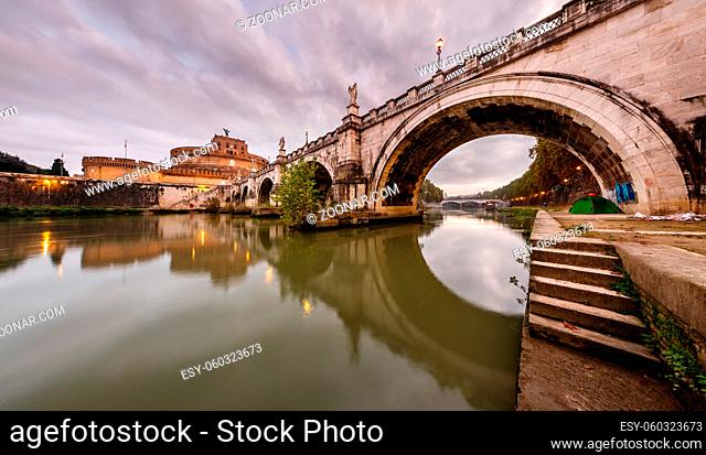 Panorama of Holy Angel Castle and Holy Angel Bridge over the Tiber River in Rome at Dawn, Italy