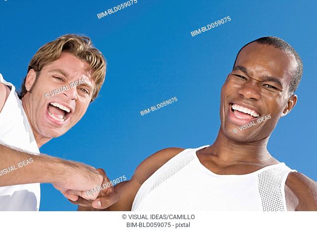 Multi-ethnic men laughing