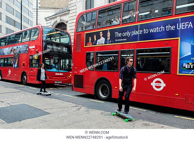 Skateboarders pass by a busy bus stop outside Victoria Station to beat the Tube Strike. Featuring: View Where: London, United Kingdom When: 06 Aug 2015 Credit:...