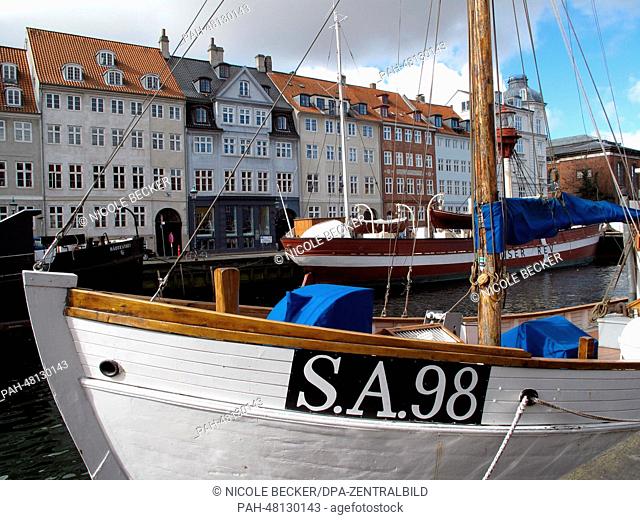 Boats are moored in the Nyhavn canal in Copenhagen, Denmark, 18 April 2014. Nyhavn is a 17th-century waterfront, which is lined by brightly coloured 17th and...