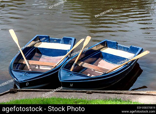 WARKWORTH, CUMBRIA/UK - AUGUST 17 : Two rowing boats moored on the River Coquet in Warkworth Cumbria on August 17, 2010
