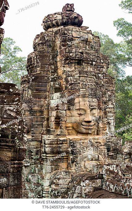 Giant stone face at the Bayon temple at Angkor Wat in Siem Reap, Cambodia